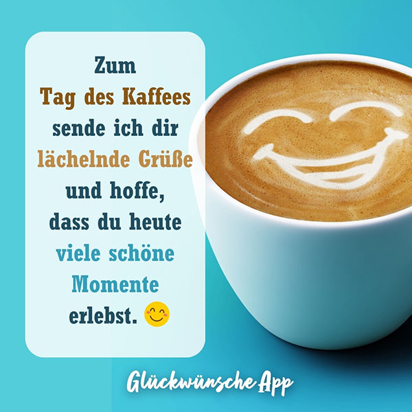 Kaffeetasse mit lachendem Gesicht im Milchschaum und Spruch daneben: „Zum Tag des Kaffees sende ich dir lächelnde Grüße und hoffe, dass du heute viele schöne Momente erlebst."